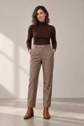 Wren Herringbone Trousers in Brown, shown on a model